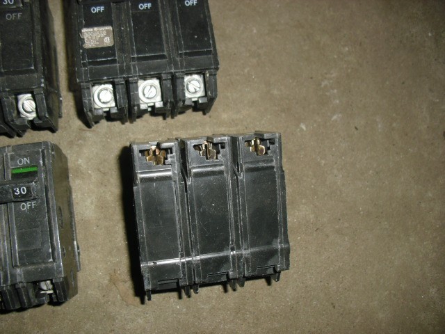 Lot of 9 used GE THQL32030 30 Amp, 240 Volt, 3 Pole, Plug In Circuit Breaker