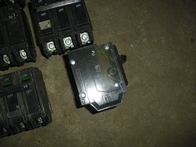 Lot of 9 used GE THQL32030 30 Amp, 240 Volt, 3 Pole, Plug In Circuit Breaker