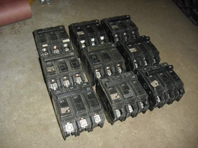 Lot of 9 used GE THQL32030 30 Amp, 240 Volt, 3 Pole, Plug In Circuit Breaker