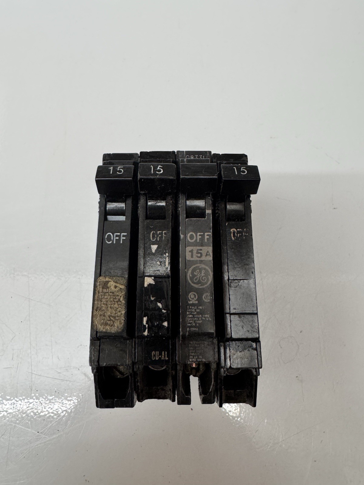 (4)- GE THQP115 15A 120V 1 POLE TYPE TQP CIRCUIT BREAKER- LOT OF FOUR