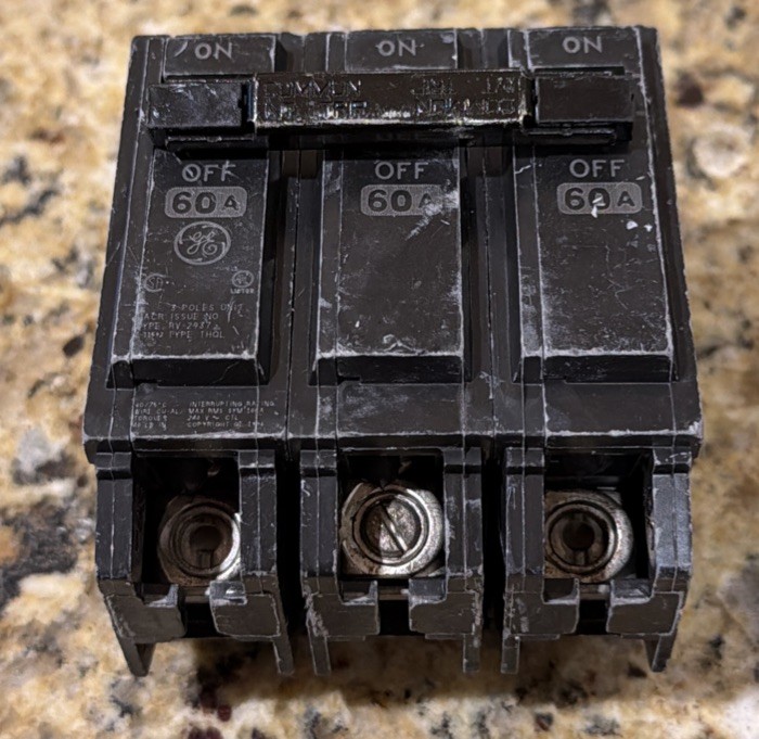 GE THQL360 COMMERCIAL CIRCUIT BREAKER 3- POLE 60 AMP PLUG IN. MISSING TWO SCREWS