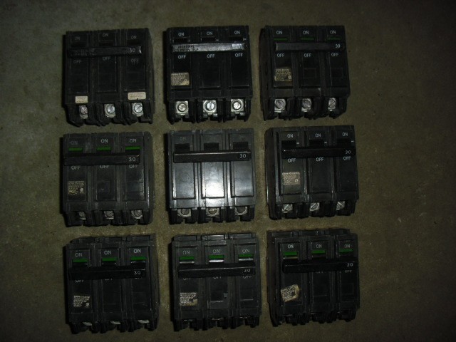 Lot of 9 used GE THQL32030 30 Amp, 240 Volt, 3 Pole, Plug In Circuit Breaker